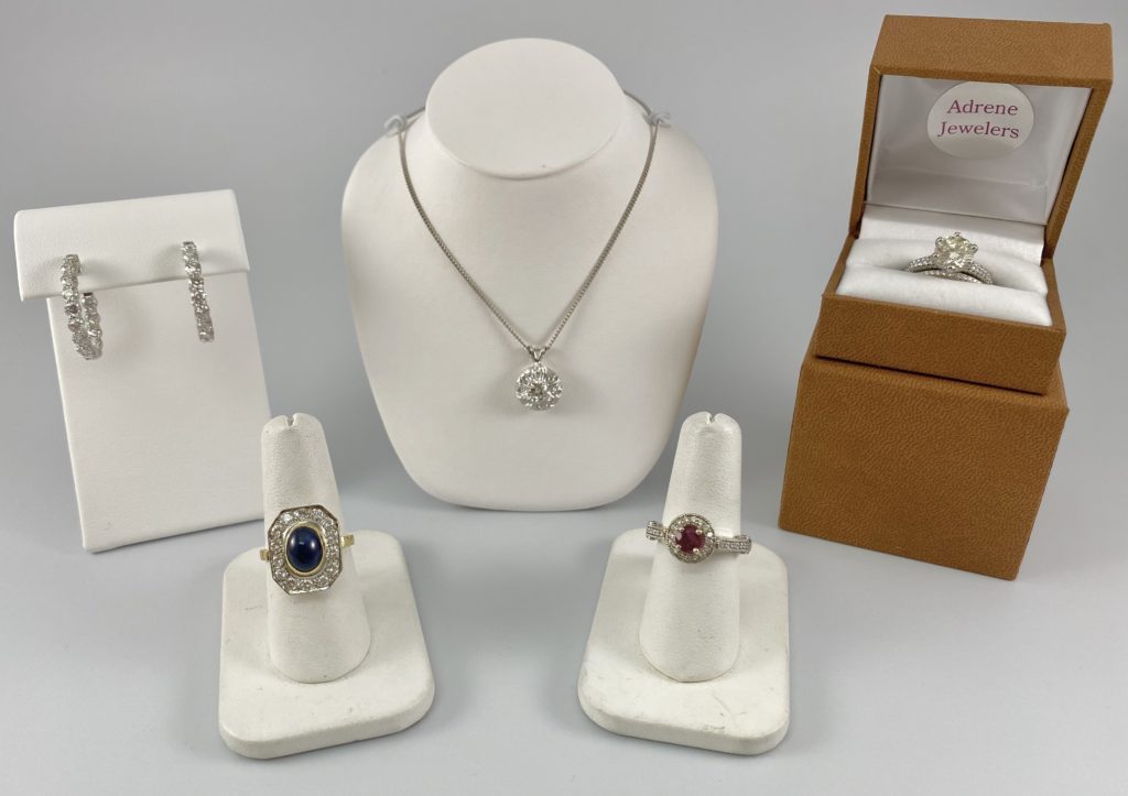 Diamond earrings, a necklace and 3 rings