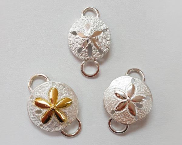 Two toned sand dollar clasps by Le Stage